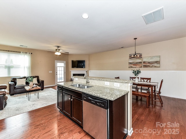 7325 Overmountain Dr, Rock Hill, SC 29732 - kitchen with dishwasher, a sink, open floor plan, dark wood-style floors, and a wainscoted wall