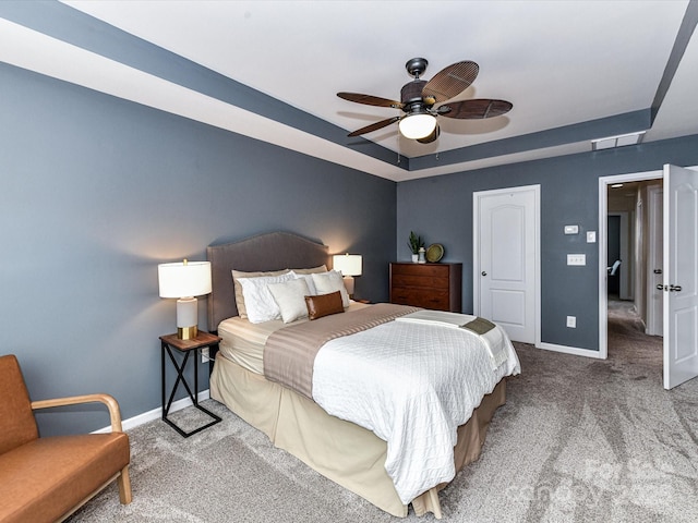 7325 Overmountain Dr, Rock Hill, SC 29732 - carpeted bedroom featuring a tray ceiling, baseboards, and a ceiling fan