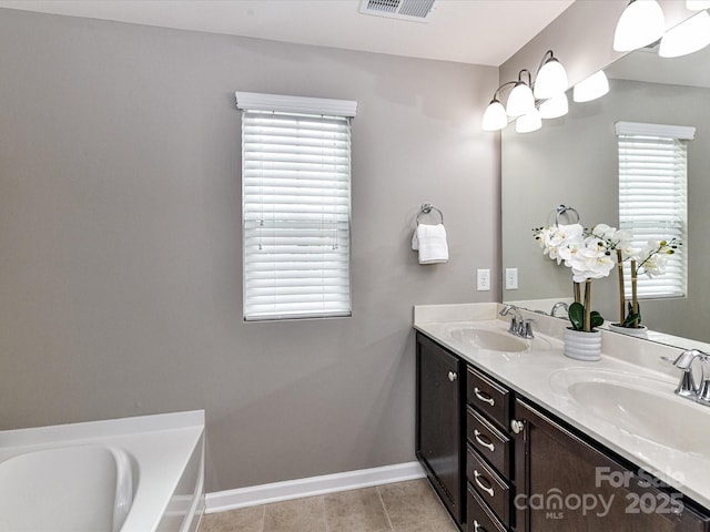 7325 Overmountain Dr, Rock Hill, SC 29732 - full bath featuring baseboards, plenty of natural light, double vanity, and tile patterned floors