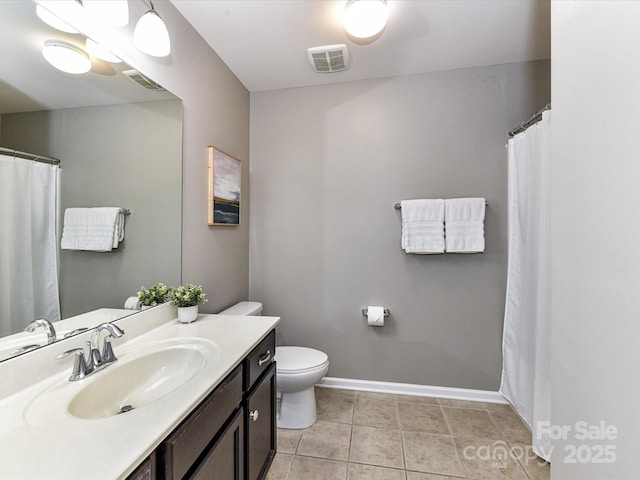 7325 Overmountain Dr, Rock Hill, SC 29732 - bathroom with toilet, vanity, tile patterned floors, and baseboards