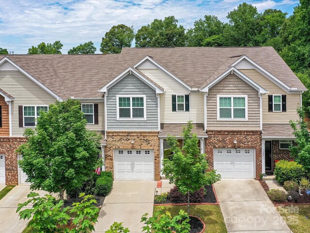 7325 Overmountain Dr, Rock Hill, SC 29732 - townhome / multi-family property featuring brick siding, concrete driveway, and an attached garage