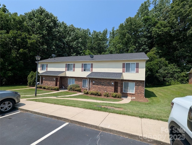 409 4th St SW, Conover, NC 28613 - multi unit property featuring brick siding, uncovered parking, and a front lawn