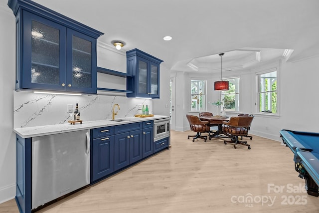 238 Horton Grove Rd, Fort Mill, SC 29715 - indoor wet bar with light wood finished floors, a raised ceiling, crown molding, stainless steel microwave, and baseboards
