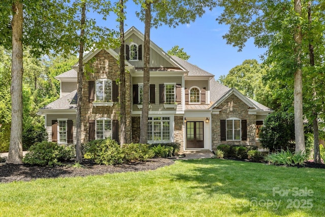 238 Horton Grove Rd, Fort Mill, SC 29715 - view of front of house featuring stone siding, a front lawn, a standing seam roof, and a shingled roof