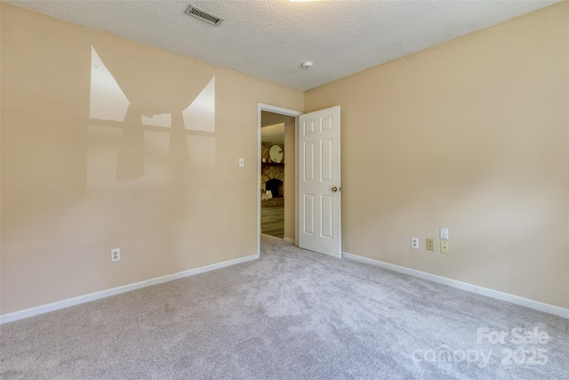 2011 20th Street Pl NE, Hickory, NC 28601 - carpeted empty room featuring a textured ceiling and baseboards