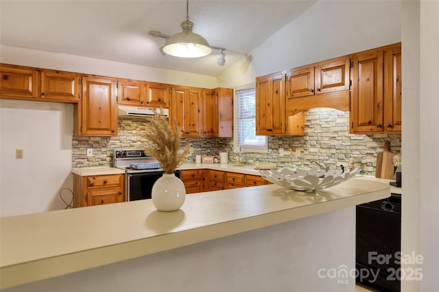 2011 20th Street Pl NE, Hickory, NC 28601 - kitchen with range with electric cooktop, under cabinet range hood, decorative backsplash, brown cabinets, and a textured ceiling