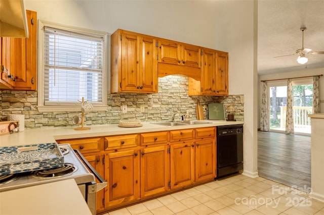 2011 20th Street Pl NE, Hickory, NC 28601 - kitchen with dishwasher, a sink, light countertops, decorative backsplash, and light tile patterned floors