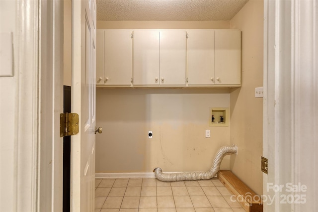 2011 20th Street Pl NE, Hickory, NC 28601 - laundry room with cabinet space, hookup for an electric dryer, light tile patterned flooring, hookup for a washing machine, and a textured ceiling