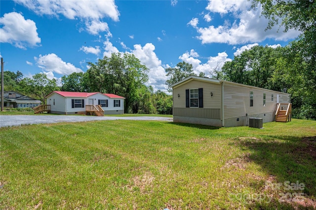 376 Puzzle Creek Rd, Bostic, NC 28018 - view of front facade with crawl space, a front lawn, driveway, and cooling unit