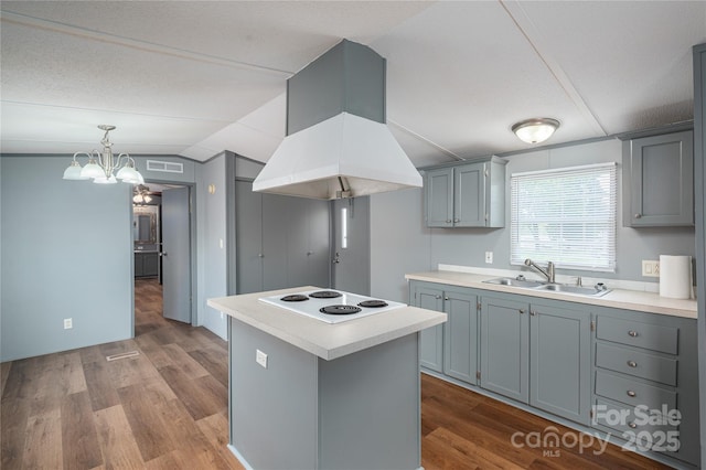 376 Puzzle Creek Rd, Bostic, NC 28018 - kitchen with a sink, white electric cooktop, island range hood, lofted ceiling, and dark wood-style floors