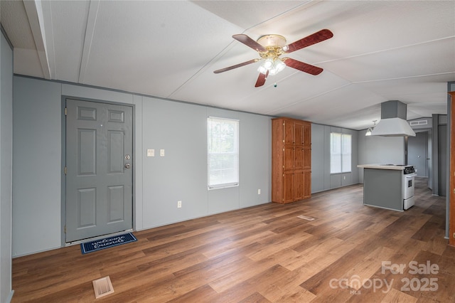376 Puzzle Creek Rd, Bostic, NC 28018 - unfurnished living room featuring lofted ceiling, ceiling fan, and wood finished floors