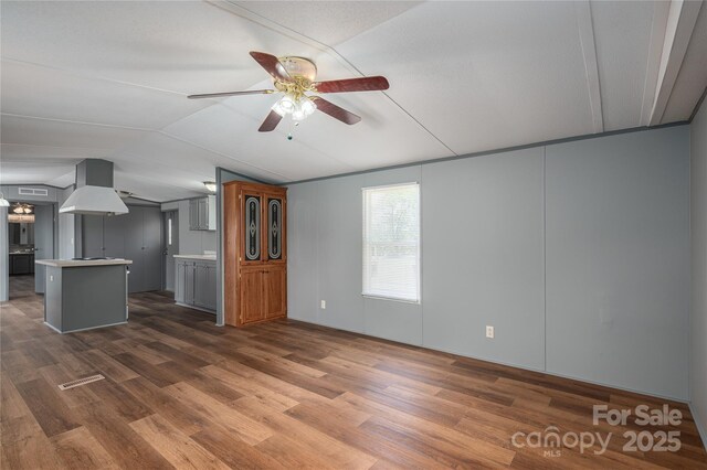 376 Puzzle Creek Rd, Bostic, NC 28018 - unfurnished living room with vaulted ceiling, dark wood-style flooring, and a ceiling fan