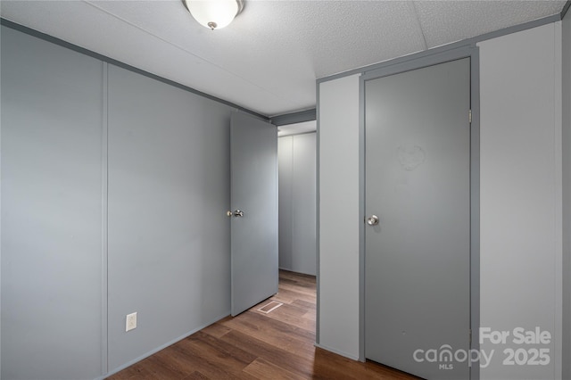 376 Puzzle Creek Rd, Bostic, NC 28018 - unfurnished bedroom featuring wood finished floors