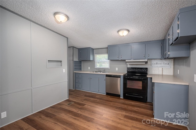 376 Puzzle Creek Rd, Bostic, NC 28018 - kitchen with black range with electric stovetop, dishwasher, blue cabinetry, a sink, and light countertops