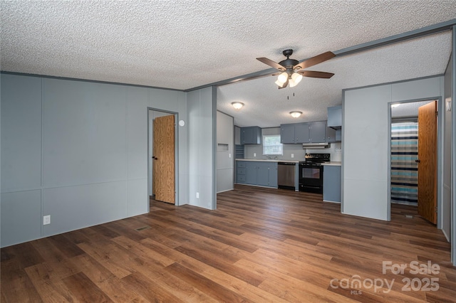 376 Puzzle Creek Rd, Bostic, NC 28018 - unfurnished living room with ceiling fan, dark wood finished floors, a textured ceiling, a decorative wall, and a sink