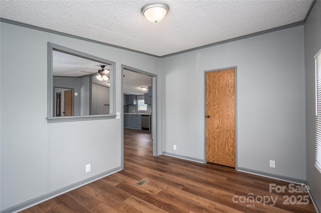 376 Puzzle Creek Rd, Bostic, NC 28018 - empty room featuring a textured ceiling, wood finished floors, a ceiling fan, ornamental molding, and baseboards