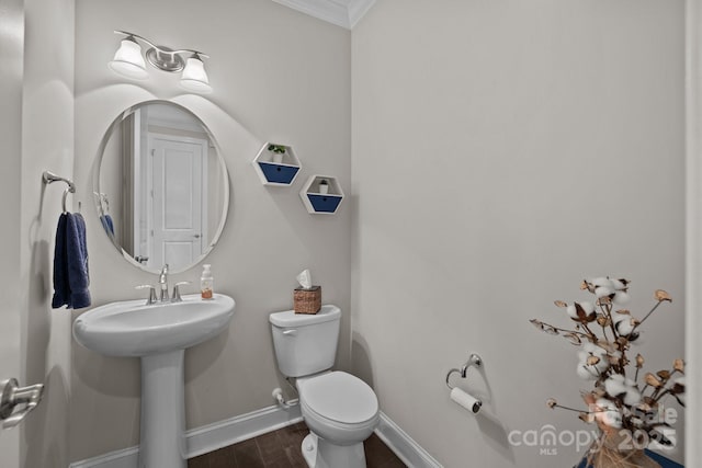 2414 Madeira Cir, Waxhaw, NC 28173 - bathroom featuring ornamental molding, toilet, baseboards, and wood finished floors