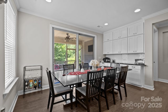 2414 Madeira Cir, Waxhaw, NC 28173 - dining area with baseboards, dark wood-style floors, recessed lighting, ceiling fan, and crown molding