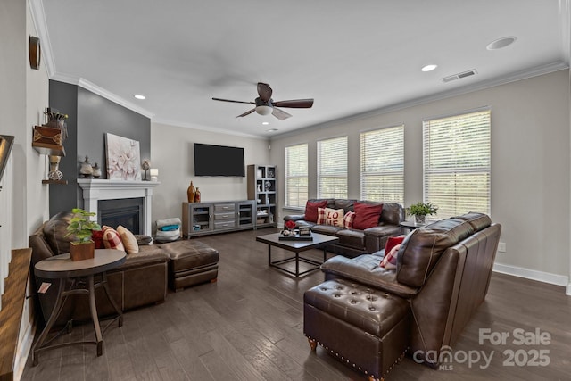 2414 Madeira Cir, Waxhaw, NC 28173 - living area featuring ceiling fan, dark wood-style flooring, crown molding, a glass covered fireplace, and recessed lighting