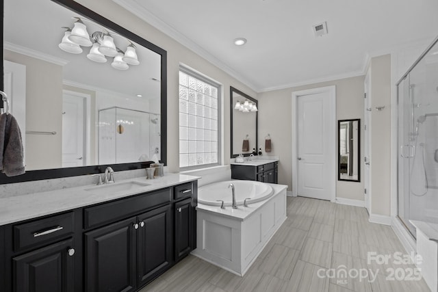 2414 Madeira Cir, Waxhaw, NC 28173 - bathroom with a stall shower, two vanities, a bath, ornamental molding, and baseboards