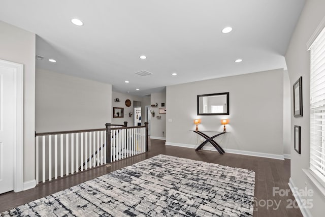 2414 Madeira Cir, Waxhaw, NC 28173 - hallway with wood finished floors, recessed lighting, baseboards, and an upstairs landing
