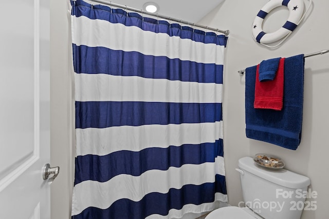 2414 Madeira Cir, Waxhaw, NC 28173 - bathroom featuring toilet and a shower with curtain