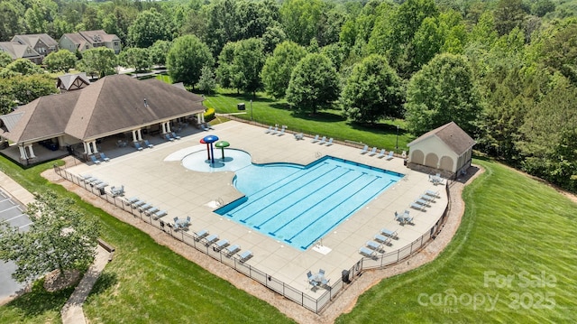 2414 Madeira Cir, Waxhaw, NC 28173 - community pool with a patio and an outdoor structure