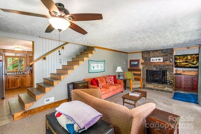 406 Poker Branch Rd, Sylva, NC 28779 - carpeted living area with stairway, a sink, a textured ceiling, a fireplace, and ceiling fan