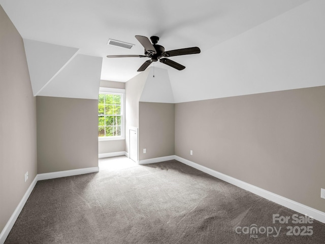 bonus room featuring a ceiling fan, carpet floors, baseboards, and lofted ceiling