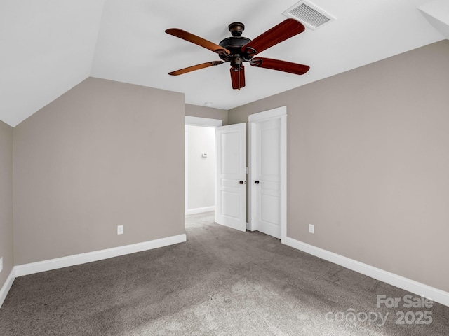 bonus room featuring ceiling fan, carpet flooring, baseboards, and vaulted ceiling