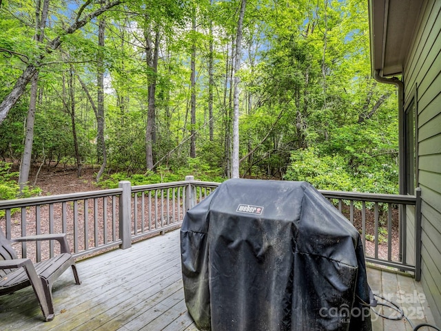 wooden deck with grilling area