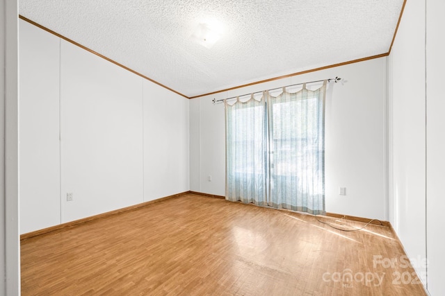 6822 Zelda Dr, Catawba, NC 28609 - unfurnished room featuring crown molding, wood finished floors, a textured ceiling, and baseboards