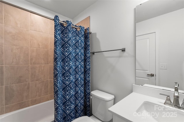 bathroom with toilet, shower / tub combo, and vanity