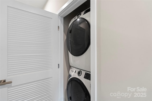 washroom with stacked washer / dryer