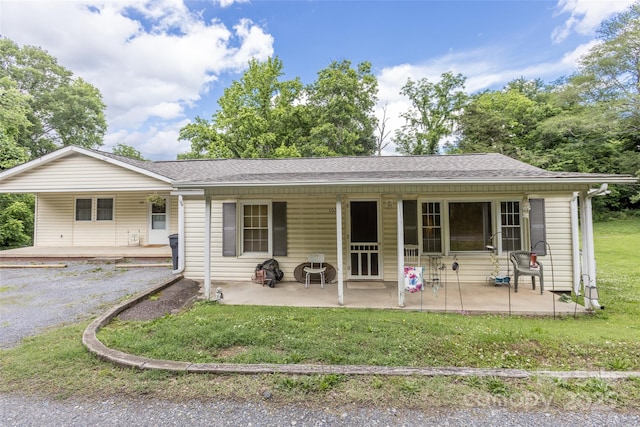 102 Lanier St, Mount Holly, NC 28120 - rear view of property with a yard, covered porch, roof with shingles, and a patio