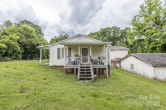 102 Lanier St, Mount Holly, NC 28120 - view of front facade with covered porch, a front lawn, and stairs