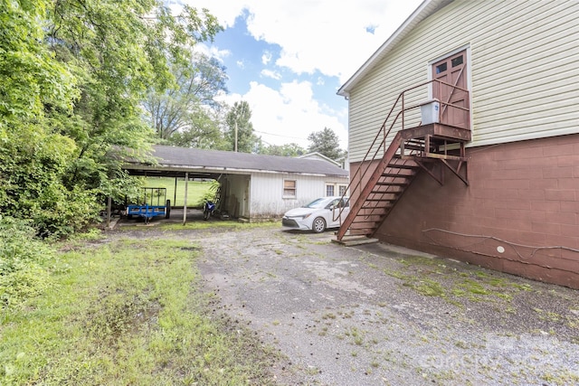 102 Lanier St, Mount Holly, NC 28120 - view of home's exterior featuring a carport