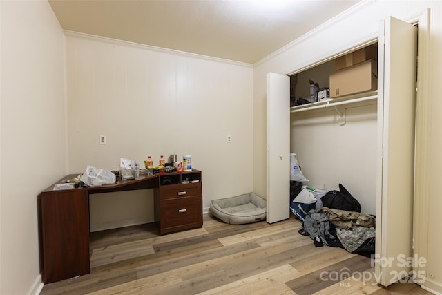 102 Lanier St, Mount Holly, NC 28120 - bedroom with light wood-style flooring, ornamental molding, and a closet
