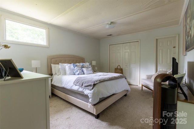 102 Lanier St, Mount Holly, NC 28120 - bedroom featuring light colored carpet, a closet, and crown molding