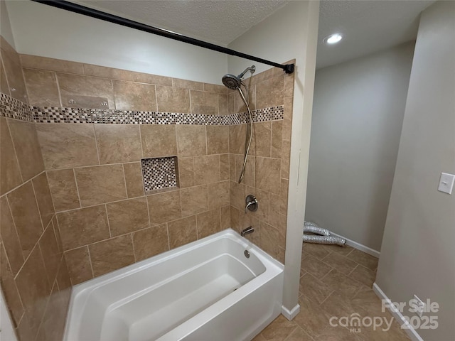1303 Rambling Acres Cir, Lenoir, NC 28645 - full bath featuring shower / tub combination, tile patterned floors, baseboards, recessed lighting, and a textured ceiling