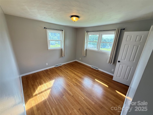 1303 Rambling Acres Cir, Lenoir, NC 28645 - empty room with wood finished floors and baseboards