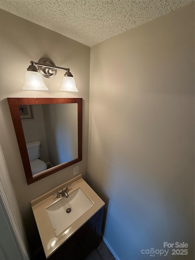 1303 Rambling Acres Cir, Lenoir, NC 28645 - half bath with toilet, vanity, and a textured ceiling