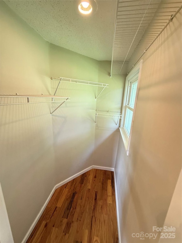 1303 Rambling Acres Cir, Lenoir, NC 28645 - spacious closet featuring wood finished floors