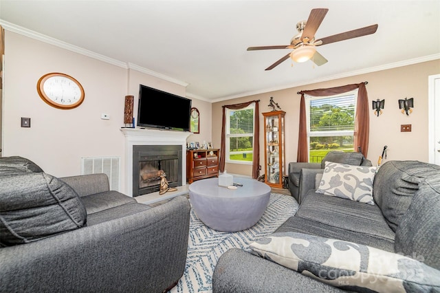2401 Hoffman St, Gastonia, NC 28054 - living area featuring ornamental molding, a fireplace with raised hearth, and a ceiling fan