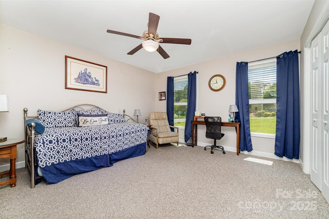 2401 Hoffman St, Gastonia, NC 28054 - carpeted bedroom with baseboards, ceiling fan, and a desk