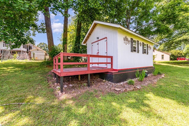 2401 Hoffman St, Gastonia, NC 28054 - view of home's exterior with a wooden deck, a yard, and an outbuilding