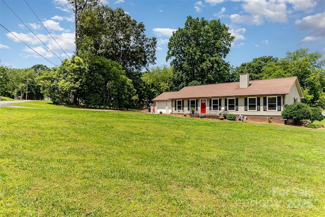 2401 Hoffman St, Gastonia, NC 28054 - ranch-style home with a chimney, an attached garage, and a front lawn