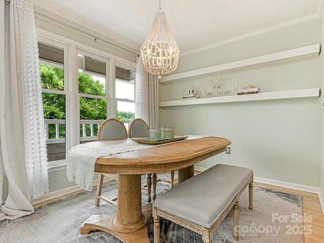 212 W 10th St Unit 3, Charlotte, NC 28202 - dining room with a chandelier, light wood-style flooring, ornamental molding, healthy amount of natural light, and baseboards