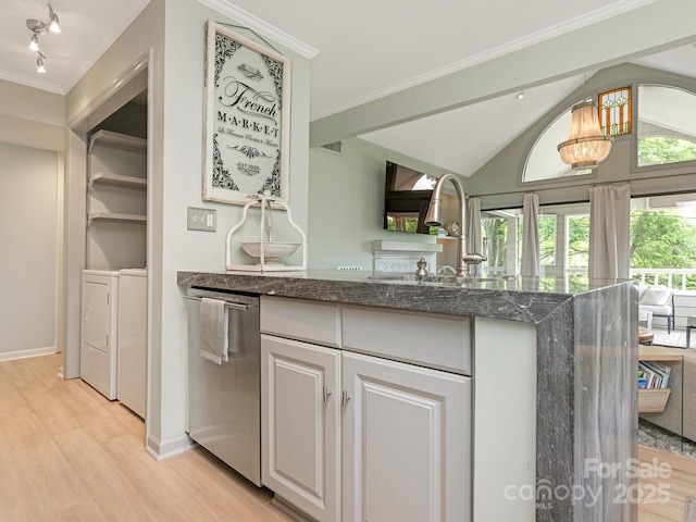 212 W 10th St Unit 3, Charlotte, NC 28202 - kitchen with separate washer and dryer, light wood-style flooring, dark stone counters, stainless steel dishwasher, and a chandelier
