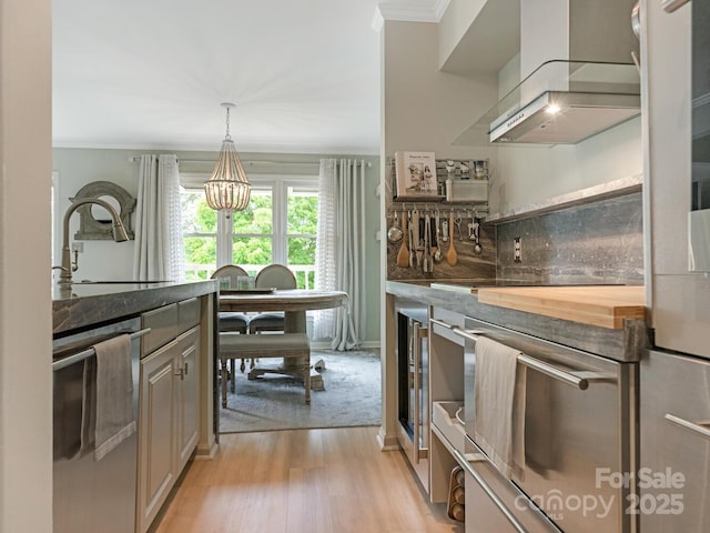 212 W 10th St Unit 3, Charlotte, NC 28202 - kitchen with dishwasher, ornamental molding, a sink, light wood-style flooring, and extractor fan